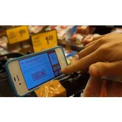 A user accessing information through the recycled smartphone on the TouchCart. 