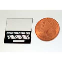 One of the new keyboards for wearables, compared to a penny.