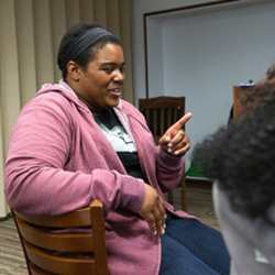 Google software engineer and Google In Residence Sabrina Williams talks with student during a Google Student Development class on Impostor Syndrome at Howard University.