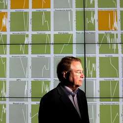 Larry Smarr, a computer scientist at the University of California at San Diego, tracks his biometric data, seen on charts behind him.