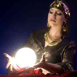 A 'fortune-teller' tries to peer into the future through her crystal ball.