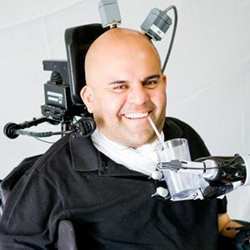 Erik Sorto, paralyzed by an accident 12 years ago, was able to move a robot arm with his mind to allow him to sip a beer. 
