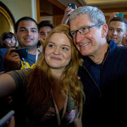 Apple CEO Tim Cook poses with a scholarship winner at the Worldwide Developers Conference.