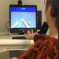 A hemiparetic stroke patient using the ' Rehabilitation Gaming System' with a Microsoft Kinect sensor