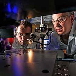 Lawrence Livermore National Laboratory engineers Eric Duoss (left) and Tom Wilson use an additive manufacturing process called direct ink writing to develop an engineered "foam" cushion. 