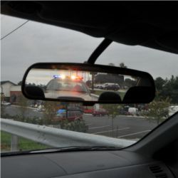 Police car in rearview mirror