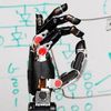 This Mind-Controlled Prosthetic Robot Arm Lets You Actually Feel What It Touches