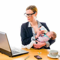 A working mother also feeding her child.