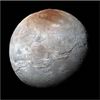Pluto's Big Moon Charon Reveals a Colorful and Violent History
