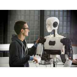 A student interacts with a robot.