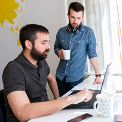 two men at laptop computer