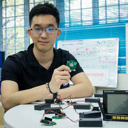 Evercomm co-founder Ted Chen, holding a wireless sensor chip that identifies factors that affect energy consumption.