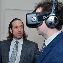     Jeremy Bailenson, founder of the Stanford University Virtual Human Interaction Lab, left, watching a participant at the 2015 Tribeca Film Festival.