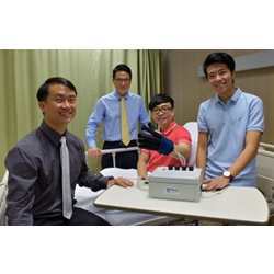 National University of Singapore researchers with a patient testing the EsoGlove.