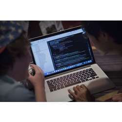 Attendees working on an Apple Inc. laptop computer participate in the Yahoo! Inc. Mobile Developer Conference Hackathon in New York in 2015.