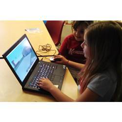 Students at Champaign, ILs Kenwood Elementary School use a laptop computer for classroom exercises.