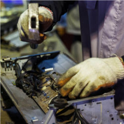 Worker dismantling printer