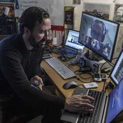  Nathan Freitas works on ChatSecure at his home office in Boston, Mass. ENLARGE Nathan Freitas works on ChatSecure at his home office in Boston, MA. 