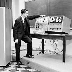 Wesley Clark in 1962, demonstrating the first Laboratory Instrument Computer (LINC). 