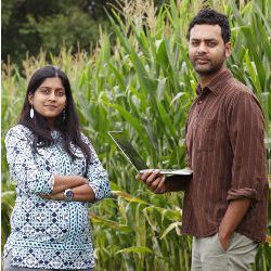 Shweta Chopra and Prashant Rajan standing near a corn field