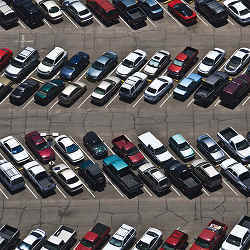 Cars in an airport parking lot.