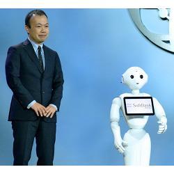 Pepper the robot with a Softbank executive at CES 2016 in Las Vegas.