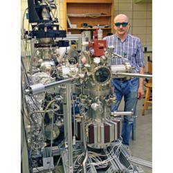 Adam Kaminski and his laser-based angle-resolved photoemission spectroscopy equipment.