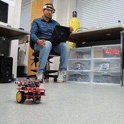 University of Florida Ph.D. student Islam Badreldin practices piloting a brain-controlled vehicle.