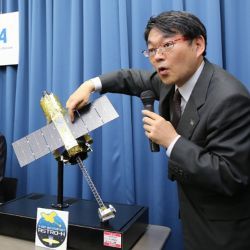 JAXA representative and Hitomi satellite model