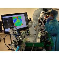 Dr. Azad Shademan and Ryan Decker during supervised autonomous in-vivo bowel anastomosis performed by the Smart Tissue Autonomous Robot.