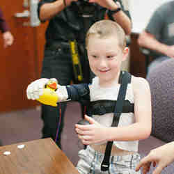 A body learns to work his new 3D-printed hand. 