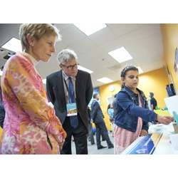 Liana Remick, 8, explains her Thinkabit Lab project to QualComm senior vice president of engineering Susie Armstrong and chief executive Steve Mollenkopf.