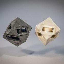 cube robots with and without shock-absorbing 'skin'