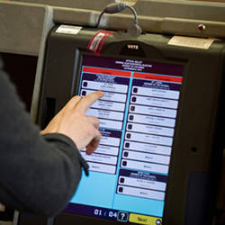 A voters casts an electronic ballot at a polling station in Washington, D.C., in 2012.