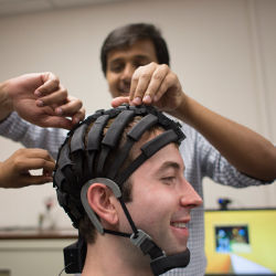 student wearing EEG headset