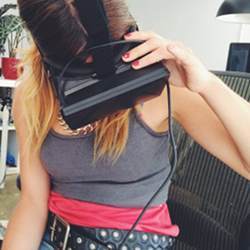 A woman using a virtual reality headset.