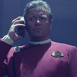 Star Trek's Captain Kirk using a universal translator.