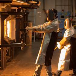 Furnace workers at Cornings research melters.