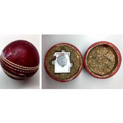 A cricket ball containing sensors wrapped in a protective case.