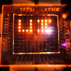 A laser stylus writes on a small array of multifunction pixels made by dual-function LEDs.