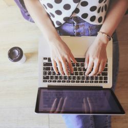 girl's hands on laptop