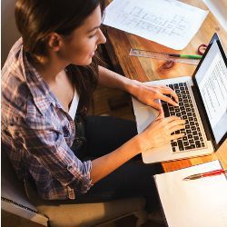 student at laptop computer