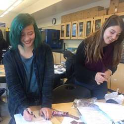 Girls at Dublin High School's engineering academy conduct an experiment about weight and density.