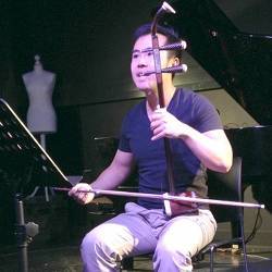 Researcher Luwei Yang plays the erhu.