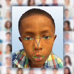 A young boy undergoes facial recognition software analysis.