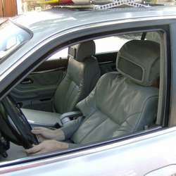 A driver disguised as an empty car seat.