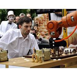 Russian chess grandmaster Alexander Grischuk plays chess with a robot.