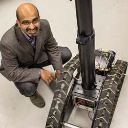  Girish Chowdhary of the University of Illinois at Urbana Champaign with the TERRA-MEPP agricultural robot.