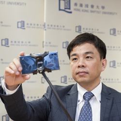 Hong Kong Baptist University (HKBU) Computer Science scholar Professor Cheung Yiu-ming demonstrates the drive fatigue detection and alert system.\