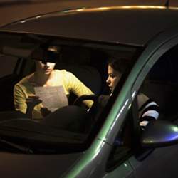 A driver distracted by the passenger, and written directions.